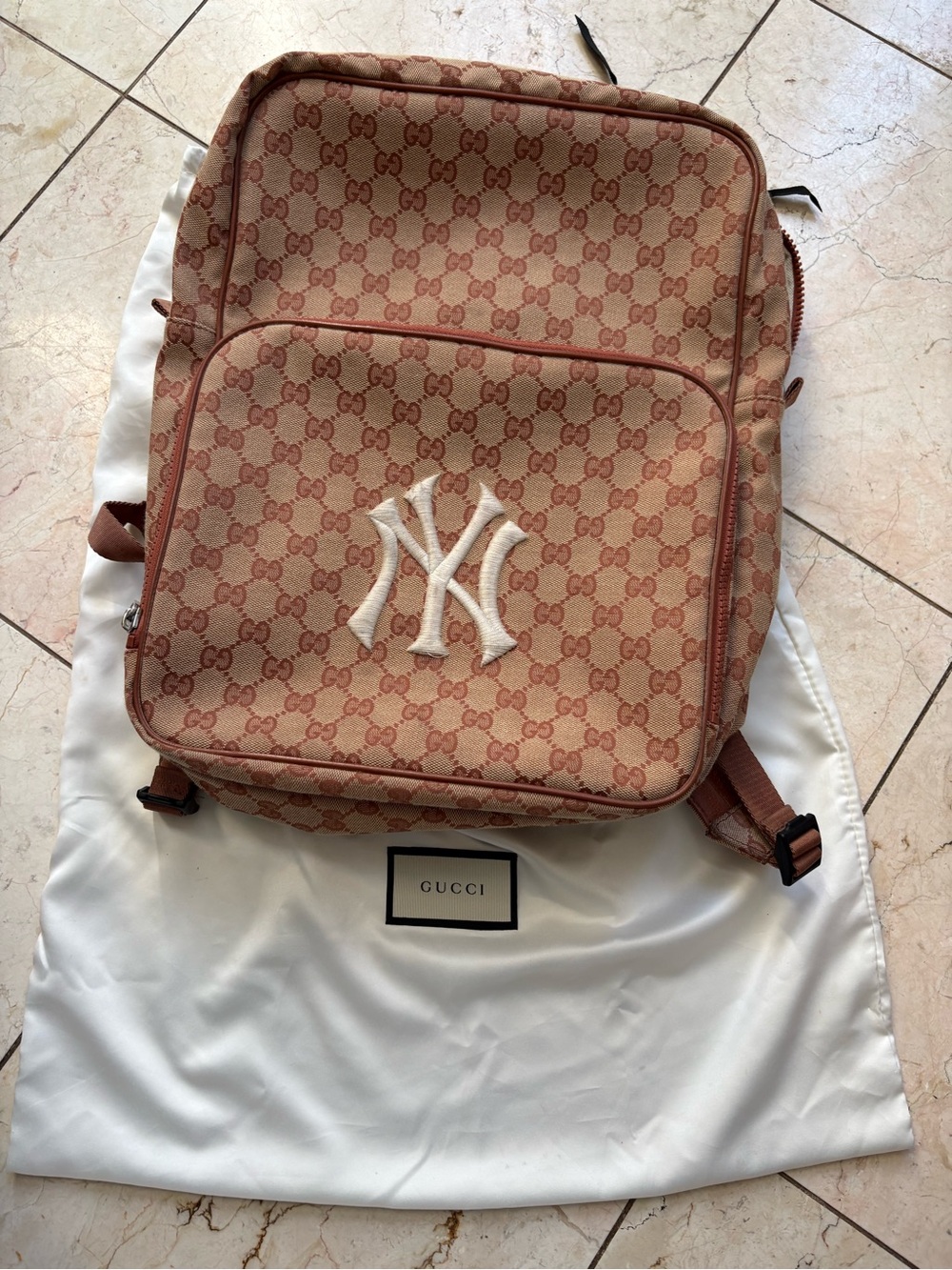 Gucci X MLB Tan/Coral GG Canvas Backpack with White NY Yankees Baseball Logo.